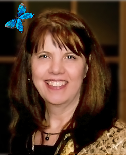 A woman with long brown hair and a blue butterfly on her head.