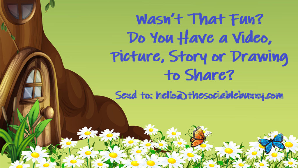 A brown bear laying in grass next to daisies.